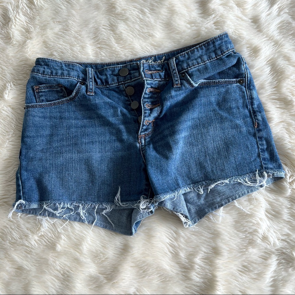 High Rise Button Fly Distressed Medium Wash Denim Shorts